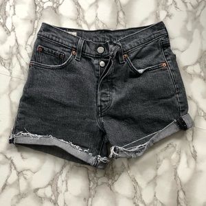 Levi’s Black 501 distressed cutoff jean shorts